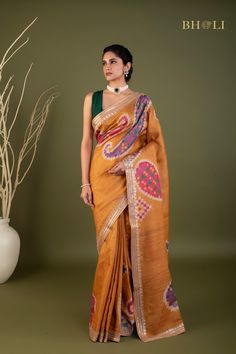 This exquisite handloom tussar silk saree features intricate gota and pearl work, handcrafted with precision and care. The digitally printed design adds a modern touch to this traditional piece, while the soft and flowy fabric ensures comfort and elegance. The perfect choice for those seeking a smart and contemporary saree. Festive Bohemian Pre-draped Tussar Silk Saree, Diwali Tussar Silk Traditional Wear With Gota Work, Unstitched Raw Silk Saree With Gota Work, Bohemian Semi-stitched Saree With Gota Work, Bohemian Saree With Gota Work, Semi-stitched Tussar Silk Saree With Gota Work, Traditional Tussar Silk Saree With Gota Work, Multicolor Tussar Silk Saree With Resham Embroidery, Traditional Tussar Silk Pre-draped Saree With Gota Work