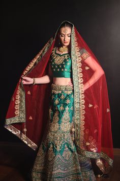 This green lehenga is hand-embroidered in gold on a silk/satin mix and comes with a beautifully designed dupatta (red) and blouse (green). The blouse has short-sleeves and has a zipper on the left side. Can be altered to size for an additional cost.  The measurements are listed as below: Lehenga Length: 39 Lehenga Waist:48 Blouse Bust: 36 Blouse Waist: 30 Blouse Length: 14.5 Sleeve Length: 4 Ceremonial Lehenga With Dori Work For Diwali, Traditional Green Dola Silk Lehenga, Bollywood Style Lehenga With Dori Work For Ceremonial Occasions, Green Dola Silk Lehenga For Traditional Ceremonies, Green Kundan Bollywood Saree, Ceremonial Dola Silk Lehenga For Eid, Green Ceremonial Salwar Kameez For Festivals, Ceremonial Dola Silk Lehenga For Diwali, Green Ceremonial Saree For Festive Occasions