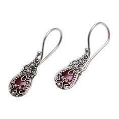 Silver blossoms crown garnets in exquisitely feminine earrings. Balinese designer Made Sriasih creates a beautiful illusion. The sparkling gems are set in sterling silver. Sterling silver and garnet Hook earrings Combination finish Natural stone - some variations in color and/or pattern are to be expected Handmade in Indonesia Elegant Garnet Teardrop Earrings, Elegant Garnet Earrings, Red Sterling Silver Filigree Earrings, Garnet Gemstone Earrings, Elegant Pierced Garnet Earrings, Elegant Ruby Earrings Nickel-free, Elegant Ruby Earrings Nickel Free, Elegant Silver Garnet Earrings, Ornate Red Sterling Silver Earrings