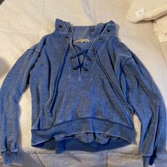 Very Soft Hoodie Never Worn, Looks Denim Material Has A Cross Tie In The Front Blue Denim Hoodie For Spring, Spring Blue Denim Hoodie, Casual Denim Blue Hooded Hoodie, Denim Blue Long Sleeve Hoodie For Spring, Long Sleeve Denim Blue Hoodie For Spring, Casual Denim Blue Hoodie For Fall, Casual Denim Hoodie For Fall, Casual Denim Blue Winter Hoodie, Denim Blue Cotton Hoodie For Fall