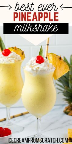 two glasses filled with pineapple milkshake on top of a white countertop