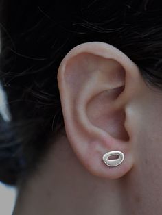 Enhance your everyday look with the whimsical shapes of these silver stud earrings. Volcanic islands from across the globe inspired the Hibu studs. These organic forms appear throughout the Tiny Islands collection, as both rings and earrings. Handmade sterling silver stud earrings with sterling backs 7mm x 9mm Organic Earrings, Unique Handcrafted Jewelry, Organic Forms, Tiny Studs, Sterling Silver Stud Earrings, Handmade Jewelry Designs, Organic Form, Silver Stud Earrings, Unique Gemstones