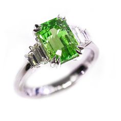 *Condition: Brand new *Center Stone: Natural Tsavorite, Baguette step cut, 2.07ct *Size: 9.2mm x 6.02mm x 4.00mm *Color: Vivid Green *Side stones: Natural White Diamond, Baguette-cut (VS1 clarity and F color) *Gold weight: 3.76g (depend on the ring size) *Metal Purity: Can be select Each piece is made-to-order with care and special attention to detail. all items are made with conflict-free diamonds and gems. Size: made to order The item will be gift wrapped and shipped. ------------------------- Luxury Tsavorite Gemstones For Anniversary, Green Sapphire Ring With Baguette Cut, Formal Emerald Cut Tsavorite Gemstone, Luxury Green Sapphire Ring Gia Certified, Green Gia Certified Sapphire Ring, Green Gia Certified Luxury Sapphire Ring, Luxury Green Sapphire Ring With Accent Stones, Green Sapphire Baguette Cut Ring, Classic Multi-stone Green Gemstones