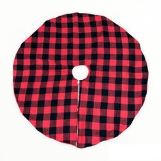 a red and black checkered cloth with a hole in the center on a white background