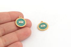 24k Shiny Gold Plated Enamel Evil Eye Charm, Stones Evil Eye Pendant, Evil Eye Necklace, Colored Evil Eye Jewelry, Description Material: Brass Size:14x17mm Hole Size:1.4mm Color:24k Shiny Gold Plated Quantity:Options Click on the link below to see our other gold-plated models https://www.etsy.com/shop/Hellojewelrysupplier?ref=seller-platform-mcnav&section_id=38471191 To return to the homepage https://www.etsy.com/shop/Hellojewelrysupplier?ref=seller-platform-mcnav Handmade Gold Charm Necklaces With Enamel, Gold Enamel Round Pendant Charms, Handmade Gold Charm Necklace With Enamel, Gold Enamel Charms For Jewelry Making, Handmade Gold Round Charms, Eye Pendant, Evil Eye Pendant, Evil Eye Charm, Evil Eye Necklace