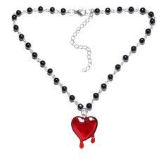 PRICES MAY VARY. Unique Design: The design of this Y2k style necklace is very avant-garde, the chain of the necklace is strung with black beads, the pendant is a red heart that is dripping blood, the heart is a symbol of love, this necklace is perfect for those who love gothic and vampire style. Reliable Material: This necklace is made of high quality acrylic beads and alloy materials, acrylic beads are non-toxic, odorless, hypoallergenic, harmless to the human body, not easy to wear for a long Trendy Red Heart Beads Necklace, Emo Heart-shaped Jewelry For Valentine's Day, Trendy Black Heart Necklace With Clavicle Chain, Edgy Heart-shaped Halloween Necklace, Emo Choker Necklaces For Valentine's Day, Emo Choker Necklace For Valentine's Day, Edgy Black Necklaces For Valentine's Day, Edgy Heart Pendant Necklace For Valentine's Day, Black Chain Necklace For Valentine's Day