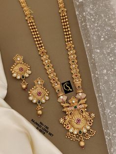 Description :- Indian Traditional Wedding Bridal Wear Gold Plated Necklace Earrings, Wedding Necklace Sets, SouthIndian Traditional Jewelry Set Bridal Wear Gift yourself a royal look with this perfectly crafted necklace set from Manalisstudio. Crafted with high quality CZ stones, it is impressive in design. The green enamel artwork adds perfect texture to the design. Perfect for weddings and festivities, this antique necklace set should be put on with your favorite sari or lehenga. 100% Satisfac Indian Traditional Wedding, Wedding Necklace Set, Necklace Set Indian, Indian Jewelry Sets, Necklace Sets, Antique Necklace, Indian Traditional, Wedding Jewellery Necklace, Earrings Wedding