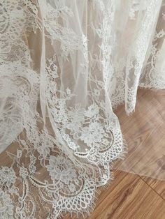 white sheer lace on a wooden floor