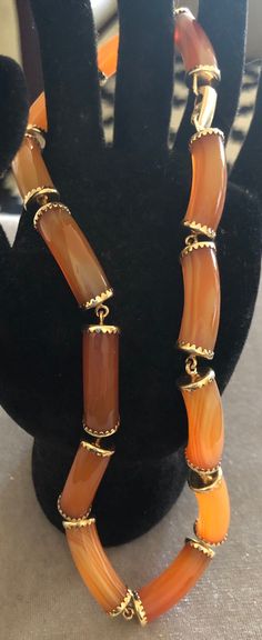 Rare Ming's Hawaii 14K Orange Agate Choker Style Necklace. Size: 14". Markings: 14K Ming's.  Orange Agate: 1/4"x3/4".  Orange Agate helps with healing, confidence, love and strength.  Pre-Owned. Sold as is. Formal Necklace With Natural Stones And Agate, Formal Agate Necklace With Natural Stones, Gold Single Strand Agate Necklace, Formal Amber Agate Jewelry, Gold Carnelian Necklace For Formal Occasions, Azurite Ring, Orange Agate, Choker Style Necklace, Choker Style