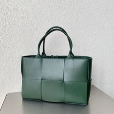 SHOP MORE LUXURY PRODUCTS HERE Description Bottega Veneta Arco Tote Bag For Women 16.14in/41cm In Green 609175VMAY33038 Size: 25 x 41 x 14 cm / 9.84 x 16.14 x 5.5 inches Handle bagDouble handleSingle detachable interior zipped pocket Include dust bag.This product is of the premium quality. Office Bags With Braided Top Handles, Office Bags With Top Handle And Braided Handles, Office Bag With Braided Top Handle, Green Top Handle Box Bag With Large Capacity, Green Large Capacity Top Handle Box Bag, Green Casual Office Bag, Green Rectangular Satchel With Large Capacity, Green Tote Shoulder Bag For Office, Green Rectangular Large Capacity Satchel