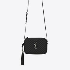 Introducing the Authentic Saint Laurent Lou Camera Bag, a stylish and compact accessory crafted from quilted leather. Featuring an adjustable leather shoulder strap, a removable tassel, and the iconic metal Cassandre logo, this bag embodies elegance and functionality. Designed for both style and convenience, it offers an exterior flat pocket for quick access to essentials, along with a spacious interior for organized storage. Crafted from 100% calfskin leather and finished with luxurious silver- Ysl Camera Bag, Ysl Crossbody Bag, Leather Camera Bag, Leather Platform Sandals, Velvet Bag, Saint Laurent Bag, Leather Tassel, Quilted Leather, Lambskin Leather