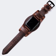 This flat, stitchless design complements the minimal look of Apple Watch series. Single layered leather watch strap with bund piece. Originally crafted for German aviators during WW2, the bund strap features an extra piece of leather within that protects the wearer's wrist from extreme temperatures. When the extra piec Adjustable Leather Watch Bands For Business, Leather Watches With Bracelet Strap For Everyday Use, Adjustable Leather Watches For Everyday, Timeless Leather Strap Watch Accessories For Everyday Use, Classic Brown Apple Watch Band For Business, Modern Leather Strap Watch Bands For Everyday, Minimalist Leather Strap Watch For Everyday, Modern Brown Watch Accessories With Waxed Finish, Minimalist Leather Strap Watch