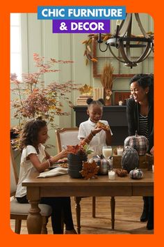 three children and an adult sitting at a table with pumpkins in front of them