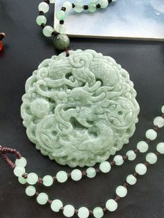 "Certified,bring money dragon circle carving natural green jadeite jade stone pendant,Rope necklace,protector,amulet,gemstone bead,Good Luck material: Grade A,100%  natural jadeite stone(Untreated ),  rope ,  Size: 49mm, width: 50m, thickness：6mm This pendant comes with a Chinese jewelry Certified, \"rich and honored,Bless and protect,you all peace and prosperity, a happy life and a successful career\"  This is the best gift for yourself or friends, family, This price is one necklace. ❤ If you want other color or length, Please connect me free  ❤Please read the store policy before purchase. ❤ Thank you for visiting my shop!" Jade Amulet, Dragon Sculpture, Chinese Jewelry, Successful Career, Snake Pendant, Rope Necklace, Jade Stone, Jade Pendant, Stone Carving