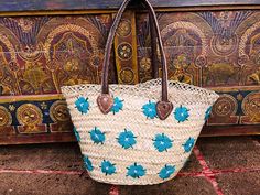 "Small round wicker French basket, hand woven in Marrakesh by friends and family. Ideal small shopper or beach bag. Also a perfect bag or gift for a girl - great for school books etc. This braided bag is perfect anytime and everywhere, Especially in the summer and there are those who like to carry them on the beach, from grocery shopping, stylish holiday accessory to home storage. It's something you won't want to leave your house without.      🌻 DETAILS 🌻 Raw Material : 100% Woven natural palm straw, wild palm doumdoum eco friendly  Trim : 100% Vegan Leather, Removable canvas pouch with a zip top closure size : 41 x 30 x 26 cm = 16.1 x 11.8 x 10.2 inches       🌻 SHIPPING 🌻 We USE FEDEX EXPRESS \"Door to Door\". for your convenience,Your order will be processed within 2-3 business days Handmade Travel Basket Straw Bag, Artisan Straw Basket Bag, Handmade Basket Straw Bag For Travel, Handmade Travel Straw Basket Bag, Straw Basket Bag With Weaving, Traditional Bucket Straw Bag With Leather Handles, Traditional Straw Bag With Braided Handles For Shopping, Traditional Straw Basket Shoulder Bag, Traditional Straw Beach Bag