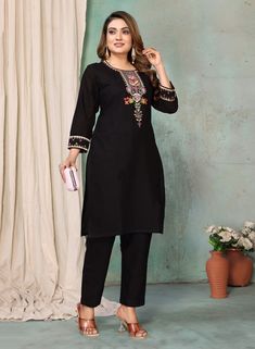 This women's kurta pant set is perfect for those who love a touch of elegance in their outfits. The black color adds a classic and versatile look, while the linen fabric ensures comfort throughout the day. The kurta is adorned with beautiful floral thread embroidery, adding a feminine and stylish touch. With a round neck and 3/4 sleeves decorated with embroidery, it's a perfect blend of traditional and modern design. The pant features a partially elasticated waist for a comfortable fit and a convenient side pocket for added functionality. Elegant Black Long Sleeve Pant Set, Cotton Sets For Workwear And Eid, Unstitched Black Cotton Sets, Elegant Black Pant Set For Work, Elegant Black Pant Set For Festive Occasions, Black Cotton Palazzo Set For Festive Occasions, Traditional Black Palazzo Set With Chikankari Embroidery, Elegant Cotton Palazzo Set For Diwali, Black Cotton Palazzo Set For Diwali