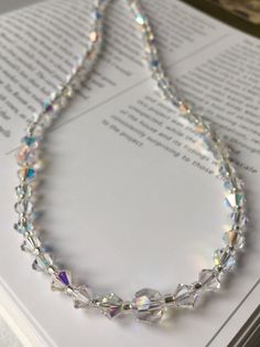 This stunning necklace is ideal for a wedding or evening occasion.  Created using Swarovski crystals, this necklace is the ultimate in elegance. The crystals are clear with an Aurora Borealis coating to create a dazzling shine.  The necklace measures 16 inches in length but can be made longer to suit if you require. It fastens with a silver lobster clasp and a two inch extender chain to allow you to alter the length.  This necklace is also available in a full range of crystal colours. Matching e Dragonfly Bracelet, Swarovski Crystal Necklace, Hair Decorations, Wedding Item, Stunning Necklace, Aurora Borealis, Pearl Bracelet, Matching Earrings, Beautiful Bracelet