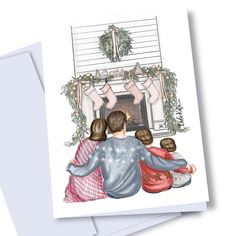 a family sitting in front of a fireplace with stockings on the mantel