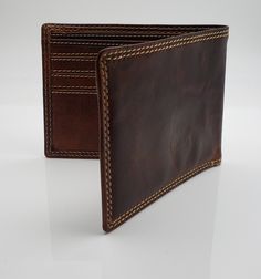 "- High Capacity Bifold Wallet - Vintage Brown Leather - 8 Standard Credit Card Slots - 2 Bill compartments - Dimensions 4.80\" x 3.75\" (closed) - Fast Free Standard Shipping - Add personalization and/or gift box to make a perfect present for a friend or loved one" Brown Bifold Wallet For Daily Use, Distressed Brown Bifold Wallet For Everyday Use, Brown Bifold Card Holder With Coin Pocket, Brown Bifold Wallet For Business, Distressed Brown Wallet With Card Slots, Rectangular Distressed Brown Wallet With Coin Pocket, Brown Bifold Wallet With Rfid Blocking, Brown Trifold Wallet With Smooth Grain, Wallet Vintage