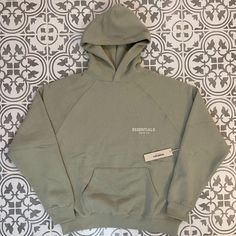 Fear Of God Essentials Sea Foam Hoodie Brand New With Tag Only Size Is Medium Which Fits Oversized Color Is Sea Foam Mails Out Within 24 Hours Green Sweatshirt With Pockets For Streetwear, Relaxed Fit Green Hooded Sweats, Green Hoodie Sweats With Pockets, Oversized Green Sports Hoodie, Green Oversized Hoodie For Sports, Oversized Green Hoodie For Sports, Green Athleisure Hoodie For Streetwear, Streetwear Green Hoodie With Pockets, Winter Khaki Hoodie With Relaxed Fit