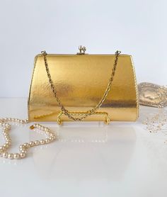 Vintage Evening Golden Clutch Hand Made | 1950's Glamorous Lady's Clutch with Golden Strap | vintage handbag In perfect vintage condition No scratches on top Size: 8" x 5" Retro Rectangular Evening Bag For Vintage Fashion, Vintage Formal Bags With Gold Clasp, Vintage Evening Bag For Vintage Events, Vintage Rectangular Evening Bag For Formal Occasions, Classic Rectangular Evening Bag For Vintage Events, Vintage Rectangular Evening Bag, Vintage Rectangular Formal Evening Bag, Retro Gold Clutch Bag, Vintage Evening Bag For Events