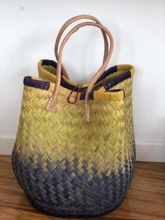 These beautiful pieces are designed in South Africa. Handmade with raffia and featuring leather handles, these bags bring the perfect mix of bohemian chic to everyday wear! Capable of being used as a handbag, basket or storage-this multi-purpose piece is a cannot miss! The double closure top provides a multi-style capability as well! Sizing: 16 inches wide x 12 inches deep x 13 inches high Bohemian Handbags, Bucket Bags, Top Handle Bags, Leather Bucket Bag, Leather Bucket, Leather Handles, Bohemian Chic, Leather Bags, Leather Handle