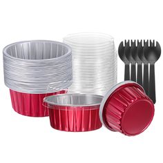 plastic cups, forks and spoons are stacked on top of each other