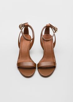 Simply chic - and able to coordinate with everything - our Filene Sandal will be a go to summer favorite.  In black or burnished brown, the mid height heel and sleek straps look perfect with everything from jeans, to a simple sheath dress.  Upper Material: Genuine LeatherOrigin: CN ImportedHeel Height: Med (3cm-5cm)With Platforms: NoOccasion: Dress, Daily, WorkSandal Type: GladiatorHeel Type: Square heelLining Material: LeatherSide Vamp Type: OpenOutsole Material:  LeatherItem Type: SandalClosure Type: Buckle StrapFit: Fits true to size, take your normal sizeBack Counter Type: Ankle StrapAge: 18 - 65, AnyStyle: RomanPattern Type: SolidInsole Material: Pig SplitGender: Women Classic Heels With 4-inch Heel And Single Toe Strap, Classic 4-inch Heels For Summer, Elegant Brown Sandals With 4-inch Heel, Brown Low Heel Heels With Buckle Closure, Classic Open Toe Sandals, Brown Ankle Strap Sandals With 4-inch Heel, Classic Summer Heels With Padded Heel, Classic Sandals With 4-inch Heel, Classic Low Heel Sandals For Formal Occasions