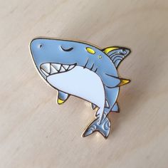 An enamel Pin of a Shark from the Water Sprite Collection.  - The Pin based metal plate is Metallic gold. - Backing is butterfly clutch. - It is approx. 1 inch on the longest side, but there is a picture of the pin next to a quarter for size reference. ** This listing is of the Great White Shark one only. The last image shows suggested pairing with another pin from the same series that are also for sale in the shop. Please check my store to see many more cute pins. Mix and match to make your own set :). Water Sprite, Butterfly Clutch, The Great White, White Sharks, Cool Pins, Great White Shark, Vinyl Toys, Great White, Dark Floral