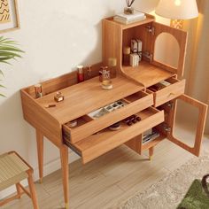 a wooden desk with drawers and shelves in the corner next to a lamp on a rug