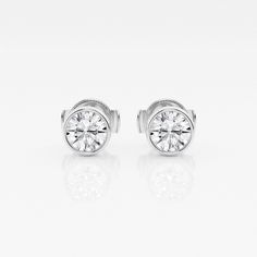 If you can't travel to Europe, then bring these classic European styled studs to you! These earrings have beautiful round lab grown diamonds set in a classic bezel setting. De rien?you're welcome! Luxury Channel Set Round Cut Earrings, Luxury Diamond White Channel Set Diamond Earrings, Luxury Bezel Setting Round Cut Earrings, Diamond White Channel Set Round Cut Earrings, Luxury Round Cut Bezel Set Earrings, Elegant Channel Set Round Cut Diamond Earrings, Timeless White Gold Diamond Earrings With Bezel Setting, Classic Diamond Earrings With Channel Set, Classic Diamond Earrings With Bezel Setting