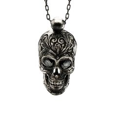 The Gothic Silver Skull Necklace is an edgy and captivating accessory that combines elements of gothic style with intricate craftsmanship. This one of a kind necklace is crafted entirely from high-quality sterling silver, adding a touch of elegance to its bold design. The centerpiece of the necklace is a sterling silver skull pendant adorned with dark Swarovski crystals in the eye sockets. The Gothic Silver Skull Necklace is a statement piece that adds a touch of intrigue and individuality to an Gothic Sterling Silver Chain Jewelry, Gothic Sterling Silver Chain Necklace, Gothic Sterling Silver Necklace With Silver Chain, Silver Gothic Box Chain Jewelry, Gothic Sterling Silver Necklaces, Silver Skull Chain Necklace, Silver Skull Shaped Chain Necklace, Gothic Sterling Silver Necklaces In Silver, Engraved Sterling Silver Skull Jewelry