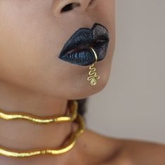 Feel like a Goddess in this one of a kind handmade wire lip cuff. Made with sturdy tarnish resistant gold or silver wire. Fully adjustable pierceless lip ring. No piercing needed just slide on and squeeze! Ships in 3-5 Business days. Perfect gift for vacations! Unique Gold Brass Ear Cuff, Elegant Adjustable Gold Septum Ring, Unique Metal Body Jewelry For Gift, Adjustable Gold Elegant Septum Ring, Unique Gold Ear Cuff, Gold Minimalist Ear Cuff For Party, Gold Sterling Silver Ear Cuff For Party, Unique Single Cartilage Earring For Party, Handmade Metal Cartilage Earrings For Party