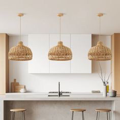 three hanging lights above a kitchen island with stools in front of it and a counter top