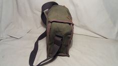 Vintage 1980's military green canvas bag - shoulder bag - NEW. Measurements: H - 10'' [ 25cm.] W - 10'' [ 25cm.] Side - 5'' [ 12.5cm.] One section and one pocket inside. Leather clasps.Adjustable canvas long handle - max.39 2/5'' [100cm.] UNUSED. NOTE: All vintage items in my shop that are used have been restored according to the possibilities All defects are removed,except the normal signs of use over the years. Thank you and successful shopping. Khaki Canvas Satchel Bag, School Satchel With Canvas Lining, Military Style Canvas Satchel Bag, Military Style Canvas Bags For Everyday Use, Military Style Satchel Shoulder Bag For Everyday Use, Khaki Canvas Satchel With Canvas Lining, Military Style Satchel For Daily Use, Vintage Canvas Satchel For School, Green Canvas Satchel For School