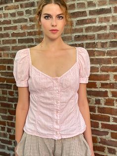 Iconic runway Miu Miu piece- pink textured cotton button up shirt--very puffy sleeves, empire waist, and deep sweetheart neckline.  A classic Miu Miu shirt from one of the best eras.  Best fits medium to large  Italian size 46  Bust 18 1/2" Waist 15 3/4" Length 20 1/2" Pink Plaid Top Outfit, Cotton Button Up Shirt Women, Fitted Pink Puff Sleeve Top For Summer, Pink Puff Sleeve Cotton Blouse, Trendy Pink Cotton Puff Sleeve Top, Pink Cotton Puff Sleeve Top Feminine Style, Trendy Fitted Pink Puff Sleeve Top, Fitted Puff Sleeve Button-up Top For Summer, Pink Cotton Top With Gathered Sleeves