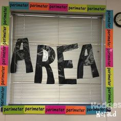 the word area spelled out in black and white on a window sill with blinds