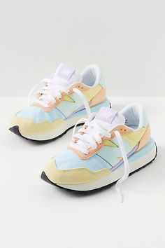 A contemporary take on a 70s-inspired silhouette, these street-ready sneakers are featured in a lightweight design and secure lace-up style with a breathable mesh lining, oversized N logo, and bold extended midsole. * Cushioned footbed* Exposed foam tongue* Durable treaded outsole Tennis Shoes Colorful, New Balance Shoes Colorful, Colorful New Balance Shoes, Women’s Sneakers, Colorful Tennis Shoes, Women’s Shoes, Cute Shoes Sneakers, Cute Tennis Shoes, Preppy Sneakers