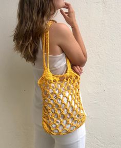 Crochet market bag handmade in a bright yellow color, perfect for summer with long and strong straps, perfect for beach days or to give an extra touch to your summer outfits. This net shoulder bag is handmade in 100% cotton, every bag is made to order, giving an extra attention to the details what makes the pice unique and timeless. Designed to be as special as her new owner. The bag includes a cotton pouch so you can keep your belongings safe! WHICH IS THE BAG SIZE? Check of the bag fits your p Summer Crochet Bag For Shopping, Summer Crochet Beach Bag For Market, Crochet Beach Bag For Summer Market, Yellow Crochet Bag For Summer, Yellow Crochet Tote Bag For Summer, Yellow Crochet Bag For Everyday Summer Use, Yellow Summer Shoulder Bag For Market, Yellow Shoulder Bag For Summer Market, Hand Knitted Summer Bag