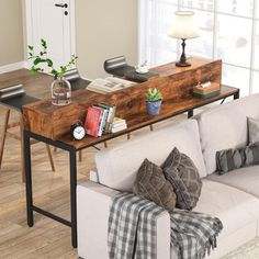 a living room filled with furniture and a wooden table in front of a white couch