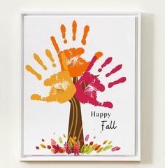 a hand print on a white wall with the words happy fall