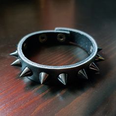 This is a Punk Black Spike & Black/White/Pink/Red Leather Cuff Bracelet. It's a gift for men or women. This will be a perfect gift for your friends. Black, white and pink bracelets are made of genuine  leather. Red bracelets are made of PU leather.(Only PU leather can make the bright red color). This product is handmade and takes 1 day to make. It will be shipped as soon as possible on the next day. This punk bracelet can be customized with a name or simple text in your preferred location. If yo Punk Noir, Pink Bracelets, Music Bracelet, Black Leather Cuff Bracelet, Spike Bracelet, Friends Black, Bracelet Wrist, Leather Cuff Bracelet, Bracelet Men