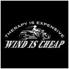 a black and white photo with the words, therapy is expensive wind is cheap on it