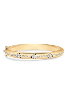 Sparkling pavé diamonds illuminate a sleek bangle bracelet crafted from high-shine 18-karat yellow gold. 6 1/2" inner circumference Push-clasp closure Total diamond weight: 1.06ct. Color: G–H Clarity: VS–SI 18k gold/diamond Imported >Diamond Guide Classic Gold Bangle Bracelet With Pave Setting, Timeless Yellow Gold Bangle With Pave Setting, Classic Yellow Gold Bangle With Pave Setting, Diamond Bangle Bracelet, Diamond Bangles Bracelet, Diamond Guide, Diamond Bangle, Bracelet Gold, G H