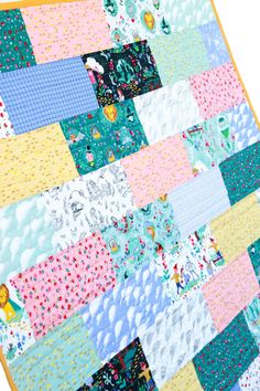 a colorful patchwork quilt on a white background