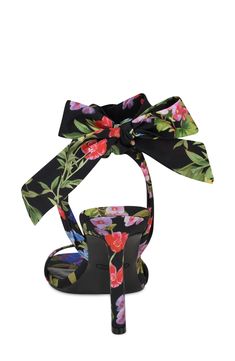 An ankle tie furthers the sweetness of a floral-patterned sandal lofted by an architectural heel for on-trend styling. 3 3/4" heel Textile upper/synthetic lining and sole Imported Ankle Tie Sandals, Black Garden, Garden Print, Sandal Women, Nine West, Nordstrom Rack, Womens Sandals, Nordstrom, Textiles