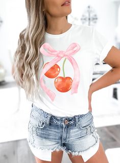 Indulge in sweet style with our Cherry Bliss T-shirt - a delightful fusion of playful charm and fruity flair! This eye-catching tee showcases a stylish bow paired with luscious cherries, creating a fun and vibrant design that's perfect for adding a pop of color to your wardrobe. Crafted from soft and breathable fabric, this tee ensures comfort without compromising on style. Whether you're headed to a summer picnic or just want to infuse your everyday look with a touch of whimsy, our Cherry Bliss T-shirt is the ideal choice. Embrace the fruity fun, and make a bold fashion statement with this uniquely designed tee that celebrates the sweetness of style. Grab yours now and let your wardrobe blossom with the joy of cherries and chicness! ❤ Gildan 2000 T-Shirt ❤ Made with 100% COTTON ❤ Wash and Cute Pink Tops For Brunch, Pink Fruit Print Tops For Summer, Sweet White Tops With Strawberry Print, Sweet Short Sleeve Tops With Fruit Print, Sweet Pink Summer Tops, Sweet Pink Summer Top, Pink Strawberry Print Shirt For Spring, Cute White Tops With Fruit Design, Cute White Top With Cherry Print