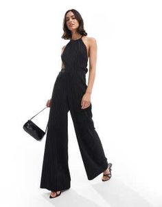 ASOS DESIGN halter tie up back jumpsuit in black and white stripe | ASOS Backless Jumpsuits And Rompers For Spring Formal, Backless Formal Jumpsuits And Rompers For Spring, Backless Formal Jumpsuit For Spring, Formal Backless Jumpsuit For Spring, Backless Strapless Jumpsuit For Summer Formal, Summer Formal Backless Strapless Jumpsuit, Striped Jumpsuits And Rompers For Party, Chic Evening Jumpsuit With Tie Back, Formal Halter Neck Jumpsuits And Rompers For Summer