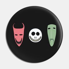 three different colored masks on a black background, one with a skull and the other with a face