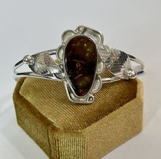 "Native American sterling silver cuff bracelet crafted in this wonderful leaf flower motif design featuring a beautiful fire agate. This special item remains in Excellent condition. Size / Item Length: 5 1/8\" Bracelet Gap Length: 1 3/16\" Width: 32.4 mm at widest point Stone Dimensions (MM): 24.7 x 13.5 mm Weight: 15.54 g https://www.etsy.com/shop/LastCenturyJewels" Bohemian Cuff Bracelet With Polished Finish As Gift, Bohemian Polished Finish Cuff Bracelet As Gift, Elegant Adjustable Jewelry With Natural Inclusions, Unique Polished Cuff Bracelet As Gift, Unique Polished Finish Cuff Bracelet Gift, Unique Polished Cuff Bracelet Gift, Unique Polished Cuff Bracelet For Gift, Oval Cuff Bracelet With Polished Finish As Gift, Flower Motif Design